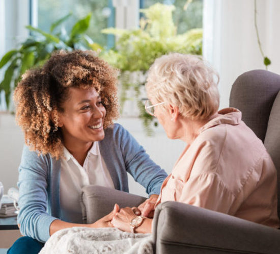 Friendly nurse supporting an eldery lady teaser image - Lagentium Insurance Brokers