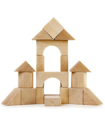 A wooden fort made out of wooden building blocks