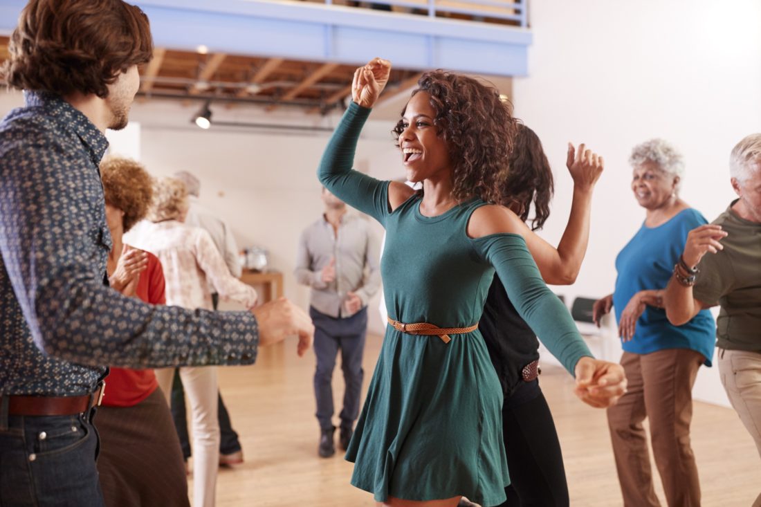 People Attending Dance Class In Community Center